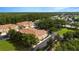 Aerial view of townhouses nestled in a lush landscape, showcasing the community's serene setting at 2011 Crestdale Ln, Lake Mary, FL 32746