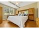Comfortable bedroom bathed in sunlight, featuring built-in wooden storage units and ample window views at 2011 Crestdale Ln, Lake Mary, FL 32746