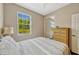Comfortable bedroom with view to the exterior and a closet at 2011 Crestdale Ln, Lake Mary, FL 32746