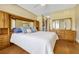 Bright bedroom showcases a large bed with light wood furnishings and an adjoining closet at 2011 Crestdale Ln, Lake Mary, FL 32746