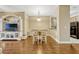 Dining area featuring modern table, hardwood floors, and an open connection to the kitchen at 2011 Crestdale Ln, Lake Mary, FL 32746