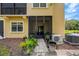 Back of Condo with Screened Patio and landscaping at 2011 Crestdale Ln, Lake Mary, FL 32746