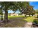 Landscaped view of condos with shade trees at 2011 Crestdale Ln, Lake Mary, FL 32746
