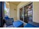 Comfortable lanai with blue wicker seating offering a serene outdoor relaxation spot at 2011 Crestdale Ln, Lake Mary, FL 32746
