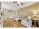 Spacious living room with hardwood floors, modern furnishings, and ample natural light at 2011 Crestdale Ln, Lake Mary, FL 32746