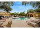 Inviting community pool surrounded by lounge chairs, perfect for relaxation and recreation at 2011 Crestdale Ln, Lake Mary, FL 32746