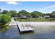 This angled aerial shows a boat dock and a beach with a park at 203 N Sweetwater Blvd, Longwood, FL 32779