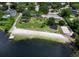 This angled aerial shows a boat dock, a beach, and a park at 203 N Sweetwater Blvd, Longwood, FL 32779
