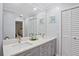 Elegant bathroom with double sinks and stylish fixtures at 203 N Sweetwater Blvd, Longwood, FL 32779
