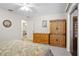 Bedroom with wood accents, including a wardrobe and dresser at 203 N Sweetwater Blvd, Longwood, FL 32779