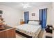 Simple bedroom with a comfortable bed and nautical themed bedding at 203 N Sweetwater Blvd, Longwood, FL 32779