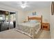 Comfortable bedroom with access to the outdoor patio at 203 N Sweetwater Blvd, Longwood, FL 32779