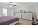Bright bedroom featuring matching dressers and neutral walls at 203 N Sweetwater Blvd, Longwood, FL 32779