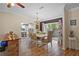 Elegant dining room with hardwood floors, chandelier, and sliding doors that lead to outdoor area at 203 N Sweetwater Blvd, Longwood, FL 32779