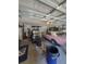 View inside garage shows a golf cart and a pink Mustang at 203 N Sweetwater Blvd, Longwood, FL 32779