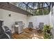 Outdoor grilling area featuring a stainless steel grill and comfortable seating at 203 N Sweetwater Blvd, Longwood, FL 32779