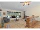 Spacious room featuring carpet, large windows with pool view, a brick bar, and an exercise machine at 203 N Sweetwater Blvd, Longwood, FL 32779