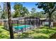 This photo shows a beautiful enclosed pool with a backyard at 203 N Sweetwater Blvd, Longwood, FL 32779