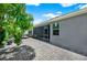 Inviting backyard featuring a screened lanai and a paved patio area, perfect for outdoor relaxation at 2319 Dammar St, Orlando, FL 32824