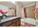 Bathroom featuring granite countertop, single vanity, and shower-tub combo at 2319 Dammar St, Orlando, FL 32824