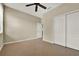 Bedroom showcasing tile flooring, ceiling fan, closet, and access door at 2319 Dammar St, Orlando, FL 32824