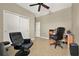 Bedroom featuring tile flooring, a closet, and furnished with a desk and chairs at 2319 Dammar St, Orlando, FL 32824