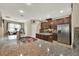 Spacious kitchen features granite countertops, stainless steel appliances, and tile backsplash, creating a modern cooking space at 2319 Dammar St, Orlando, FL 32824