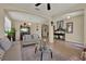 Elegant living area with neutral decor, tile floors, decorative archways, and stylish furnishings at 2319 Dammar St, Orlando, FL 32824