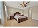A beautiful primary bedroom showcasing a decorative ceiling fan, creating a comfortable and inviting space at 2319 Dammar St, Orlando, FL 32824