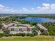An aerial view showing complex with stunning lake views and mature landscape at 2550 N Alafaya Trl # 9201, Orlando, FL 32826