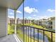 Relaxing balcony overlooking a pond and community buildings at 2550 N Alafaya Trl # 9201, Orlando, FL 32826