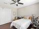 Cozy bedroom featuring a ceiling fan, closet, and desk at 2550 N Alafaya Trl # 9201, Orlando, FL 32826