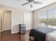 Includes a window with blinds, hardwood floors, and a closet, offering practical storage solutions at 2550 N Alafaya Trl # 9201, Orlando, FL 32826