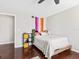 Shows hardwood floors, neutral walls, and simple furnishings, providing a cozy and functional living space at 2550 N Alafaya Trl # 9201, Orlando, FL 32826