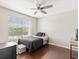 Offers a well-lit space with hardwood floors, a ceiling fan, and a large window at 2550 N Alafaya Trl # 9201, Orlando, FL 32826