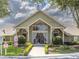 Exterior of the community clubhouse featuring large windows and landscaped grounds at 2550 N Alafaya Trl # 9201, Orlando, FL 32826