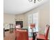 Dining room area with a glass table, red chairs, and sliding glass doors to patio at 2550 N Alafaya Trl # 9201, Orlando, FL 32826