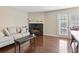 Cozy living room features a fireplace and a sliding glass door to the outside at 2550 N Alafaya Trl # 9201, Orlando, FL 32826