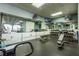 Community gym with free weights, benches, and mirrors for a complete workout experience at 2628 Balforn Tower Way, Winter Garden, FL 34787