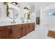 Beautiful bathroom with dual vanities, shiplap walls, and a bright, airy ambiance at 27071 Moss View Dr, Tavares, FL 32778