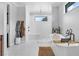 Luxurious bathroom featuring a soaking tub, walk-in shower, and modern fixtures at 27071 Moss View Dr, Tavares, FL 32778
