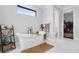 Elegant bathroom with a standalone tub, stylish decor, and plenty of natural light at 27071 Moss View Dr, Tavares, FL 32778