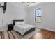 Cozy bedroom with modern rug, ample natural light, and sleek design at 27071 Moss View Dr, Tavares, FL 32778