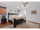 Cozy bedroom with a large bed, wooden accents, and a welcoming atmosphere at 27071 Moss View Dr, Tavares, FL 32778