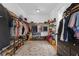 Spacious walk-in closet with custom shelving and storage for clothes, shoes, and accessories at 27071 Moss View Dr, Tavares, FL 32778