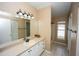 Bathroom features a large mirror, tile floors, vanity and shower/tub combo at 302 Cello Cir, Winter Springs, FL 32708