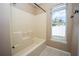 Bathroom features a shower/tub combo and a window at 302 Cello Cir, Winter Springs, FL 32708