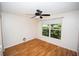 Bright bedroom featuring hardwood floors, a ceiling fan, and a window with natural light at 302 Cello Cir, Winter Springs, FL 32708