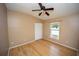 Bedroom with laminate floors, ceiling fan, window, and standard closet at 302 Cello Cir, Winter Springs, FL 32708