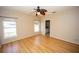 This bedroom features laminate floors, ceiling fan, two windows and neutral paint at 302 Cello Cir, Winter Springs, FL 32708